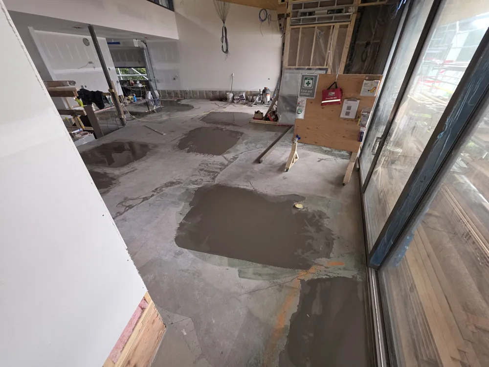 Local leveling areas beside the glazing in the Lions Bay custom home during construction