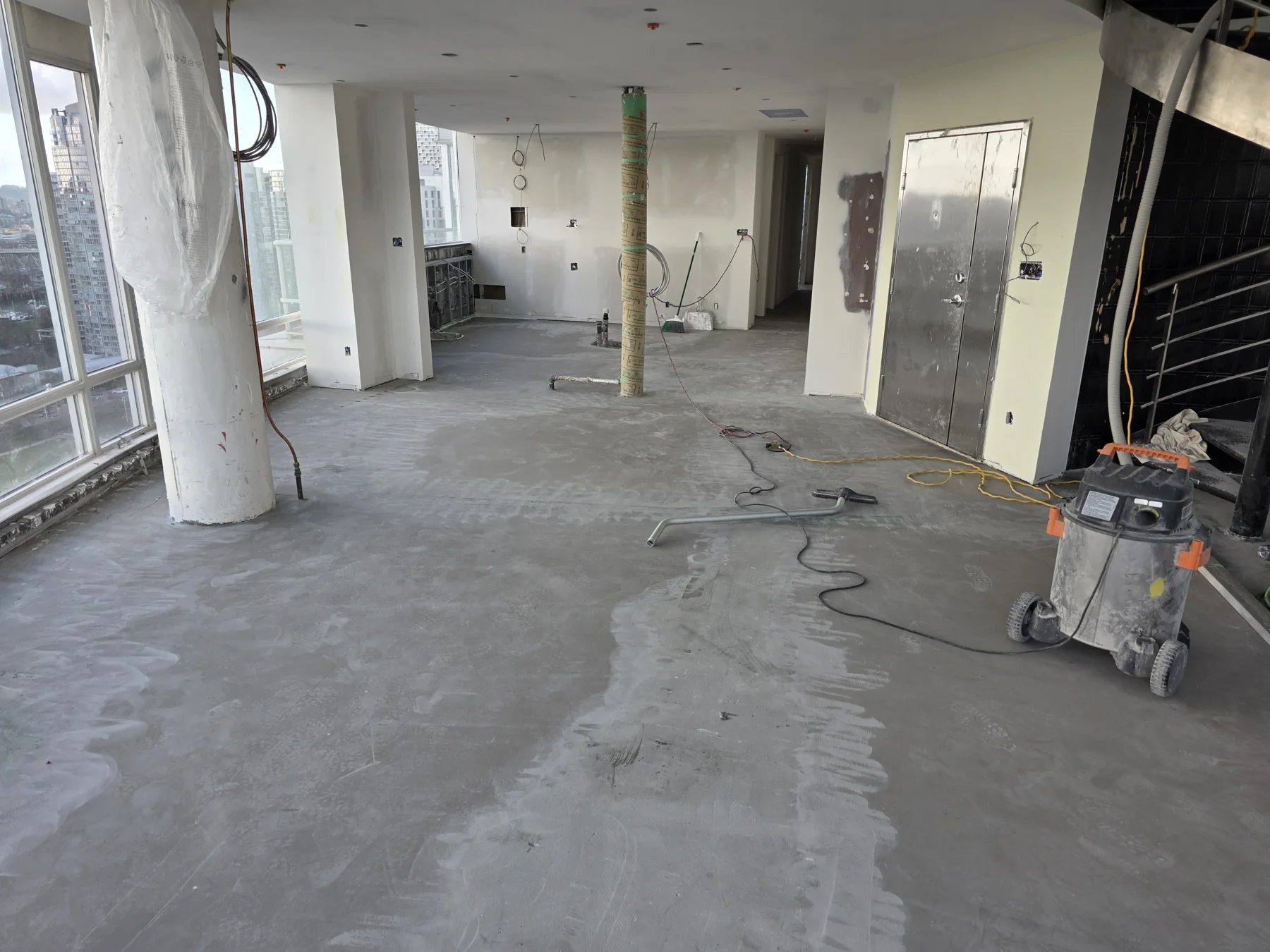 Subfloor preparation across the main living area at Marinaside during renovation