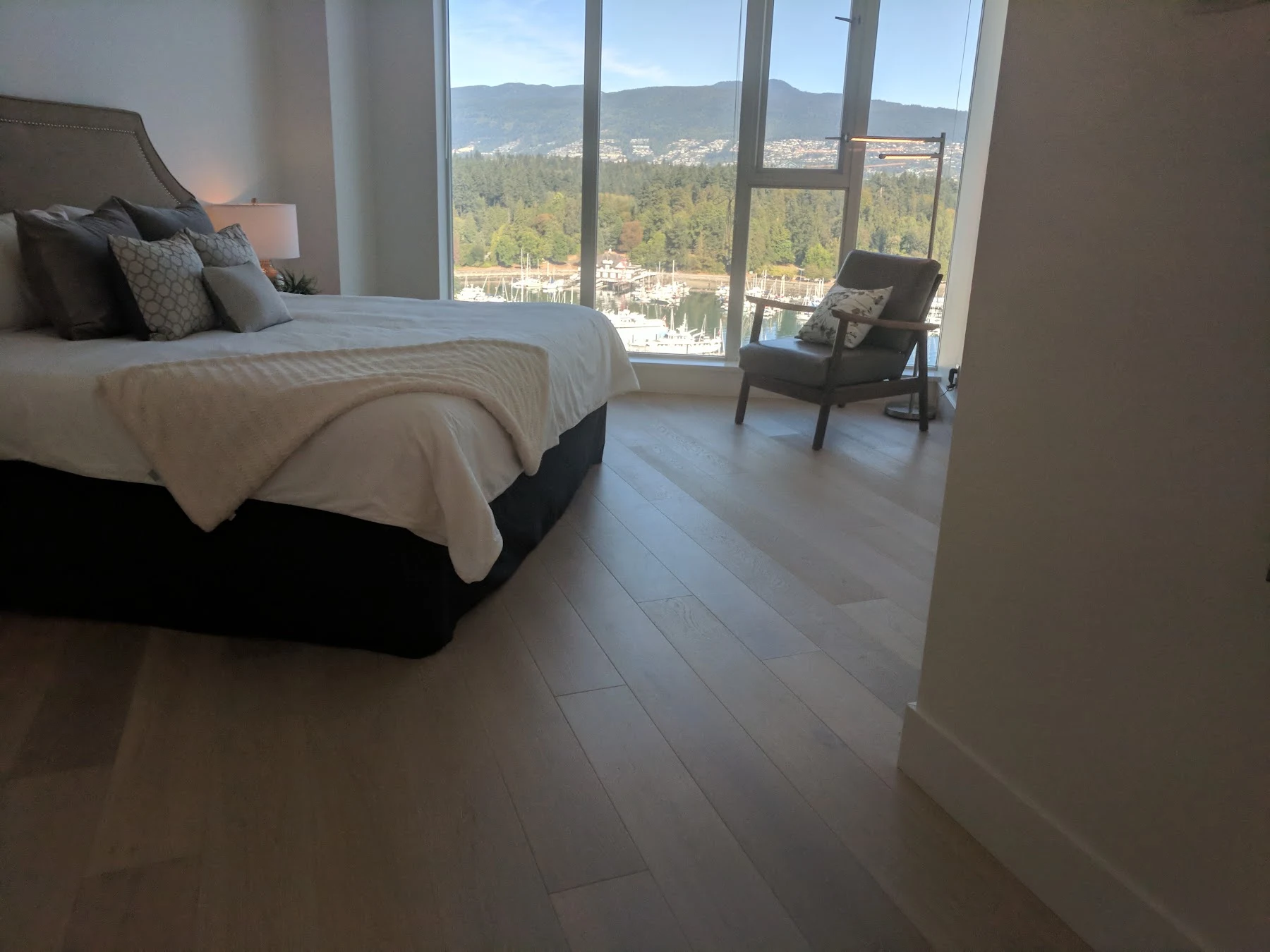 Hardwood in the penthouse bedroom, overlooking the marina and North Shore mountains.