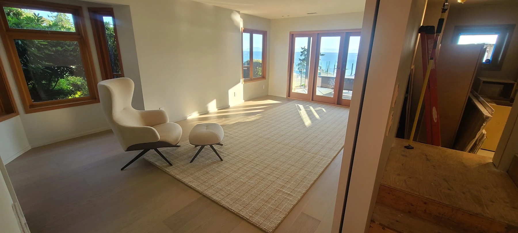 Oak flooring and a quiet reading corner overlooking the water.