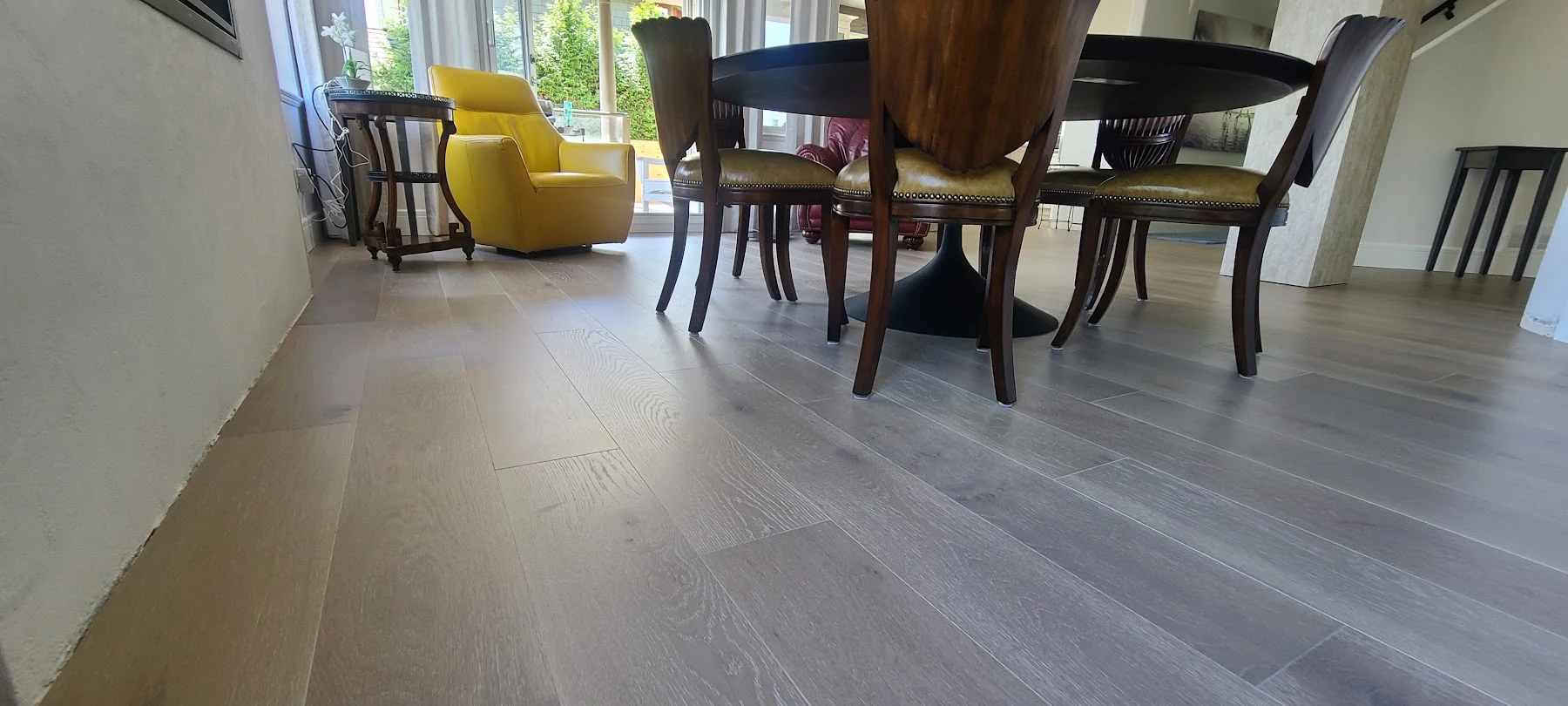 The grain and board lines across the dining room floor.