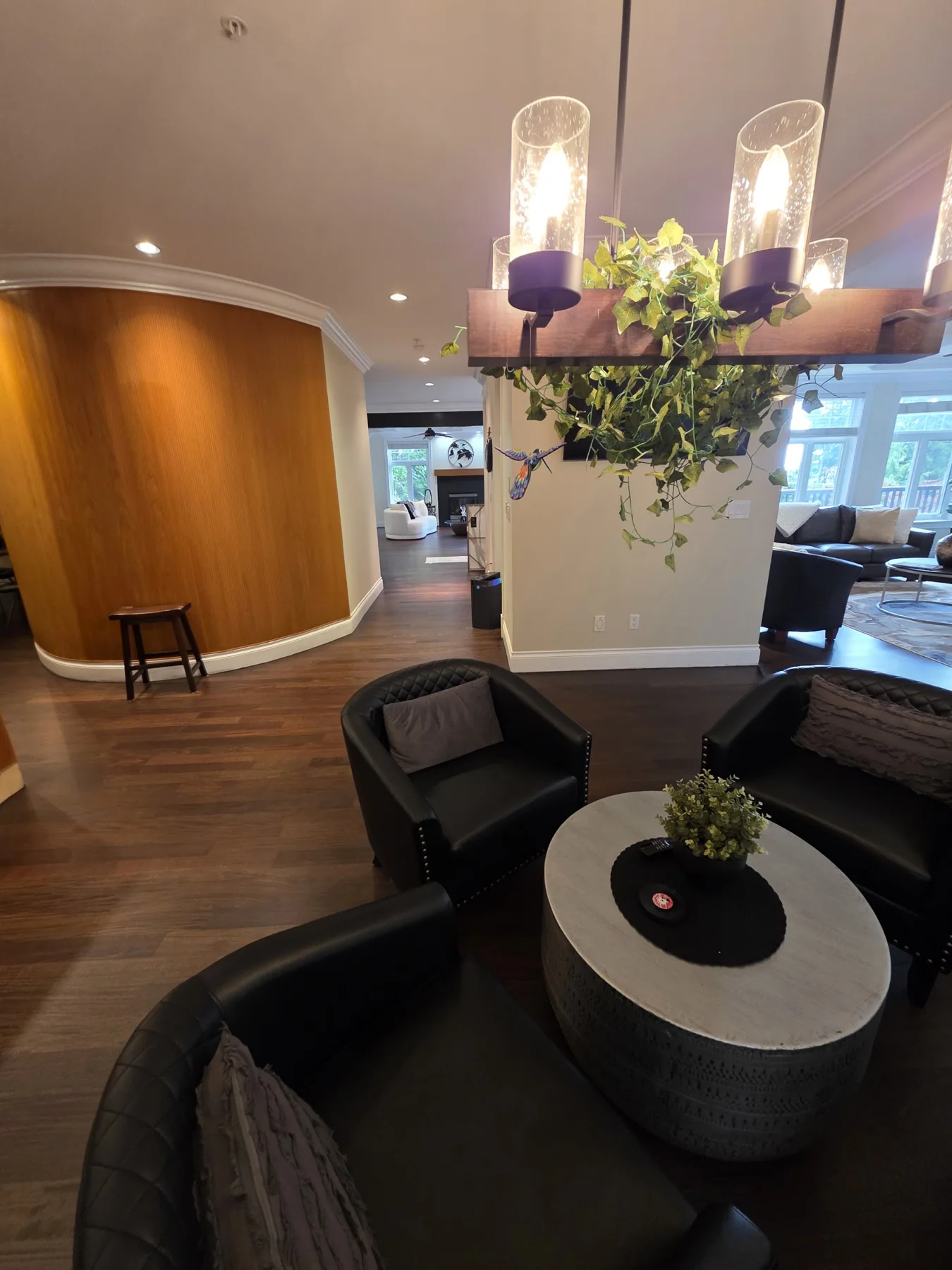 The refinished floor through the furnished dining area.
