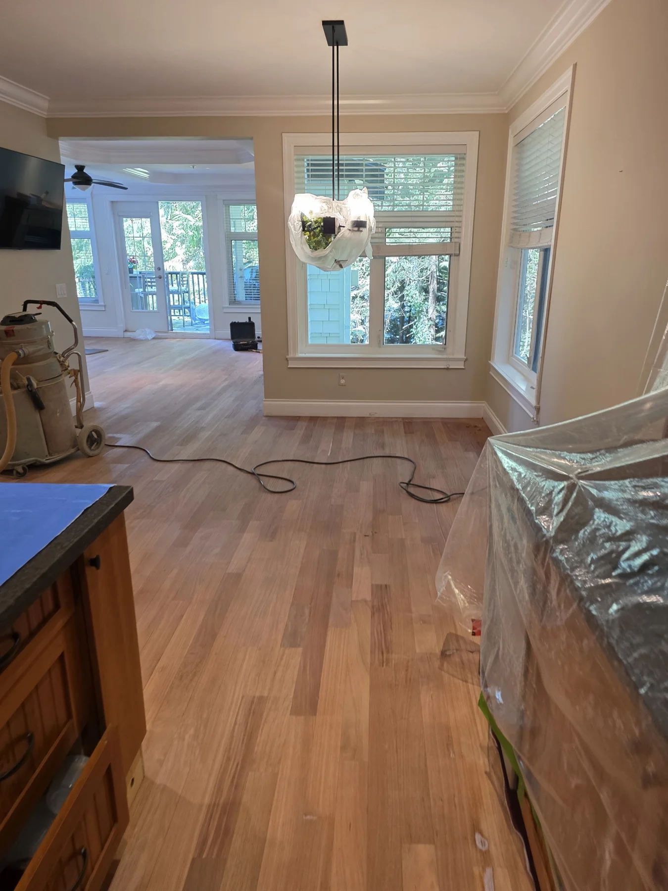 The dining-area floor after sanding, before staining.